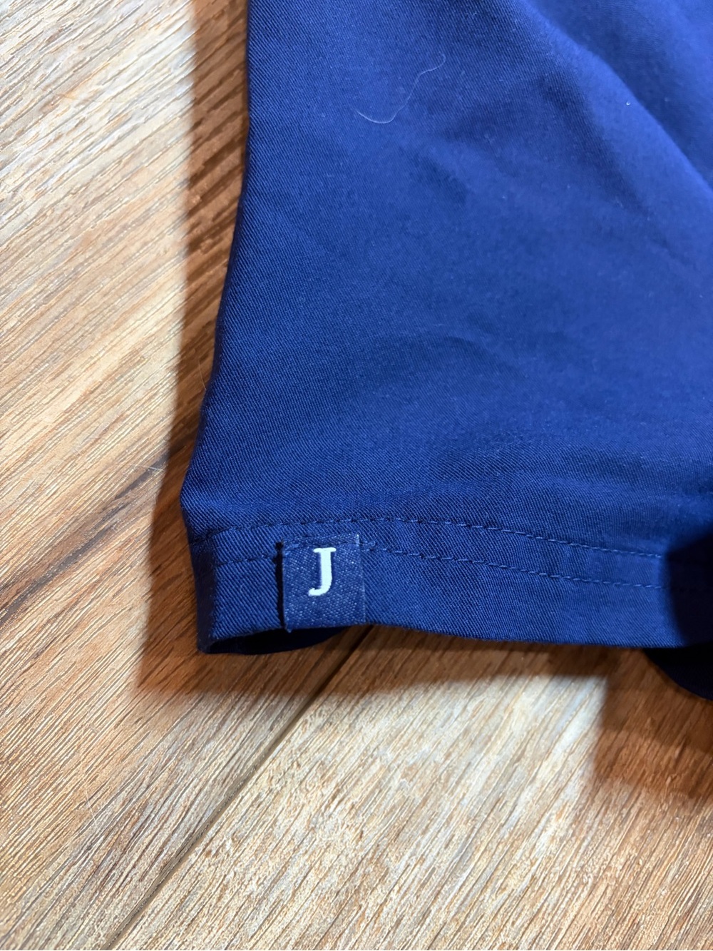 Jaanuu Women's Helia V-Neck Scrub Top in the color Midnight Navy - Picture 6 of 7